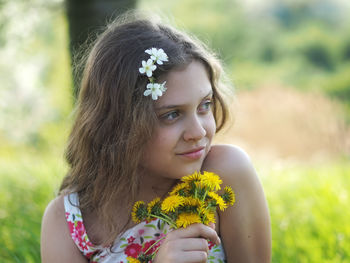 Portrait of woman with flower head