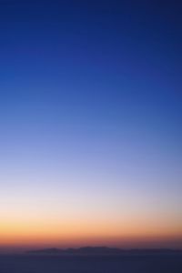 Scenic view of silhouette landscape against clear sky during sunset