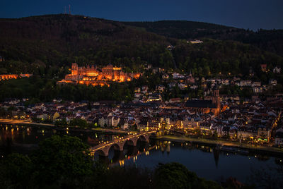 High angle view of illuminated town at night