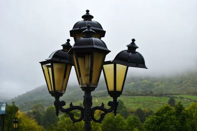 Low angle view of street light against sky