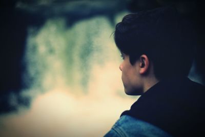 Close-up portrait of silhouette man against sky