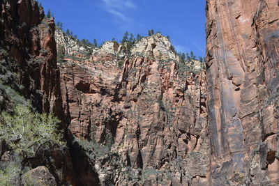 Low angle view of rock formations against sky