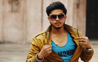 Young man wearing sunglasses standing outdoors