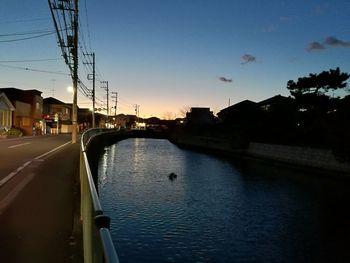 View of city against sky at sunset