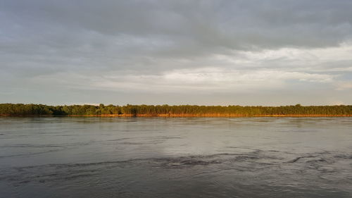 Scenic view of landscape against cloudy sky