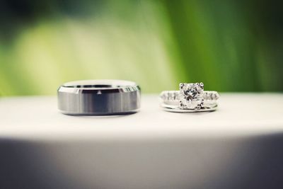 Close-up of wedding rings on table