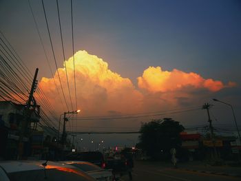 Silhouette city against sky during sunset
