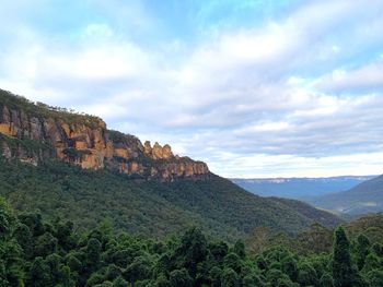 Scenic view of mountain against cloudy sky