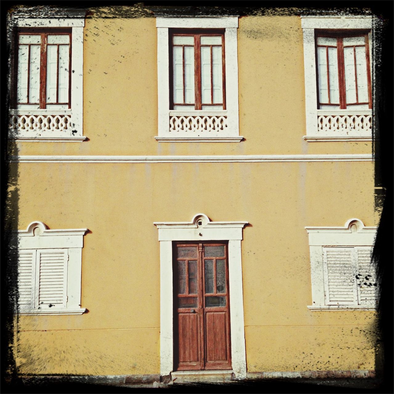 building exterior, architecture, built structure, window, residential building, door, residential structure, building, closed, house, facade, yellow, day, outdoors, entrance, low angle view, no people, shutter, glass - material, city