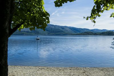 Scenic view of lake with mountains in background