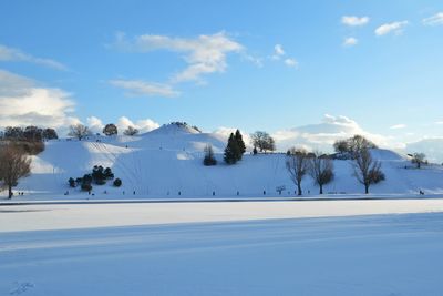 Scenic view of snow covered mountains against sky