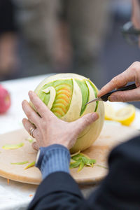 Close-up of hand holding fruit