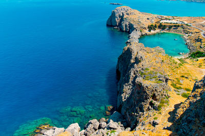 High angle view of rocks by sea