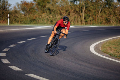 Man riding bicycle on road