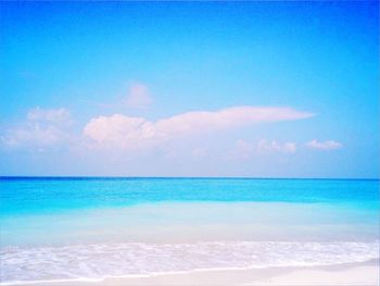 Scenic view of sea against blue sky