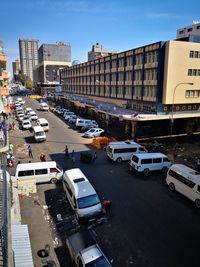 High angle view of traffic on city street and buildings