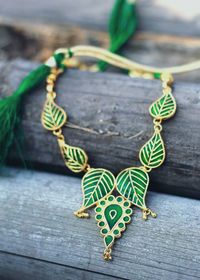 Close-up of necklace on wooden table