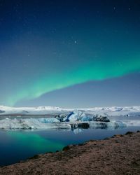 Scenic view of sea against sky at night