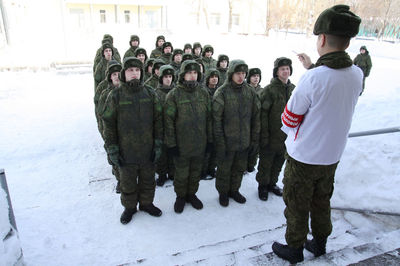 Group of people standing in snow