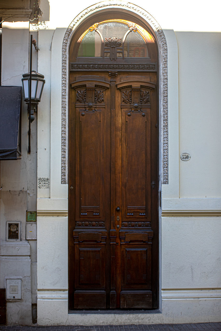 CLOSED DOOR OF OLD HOUSE