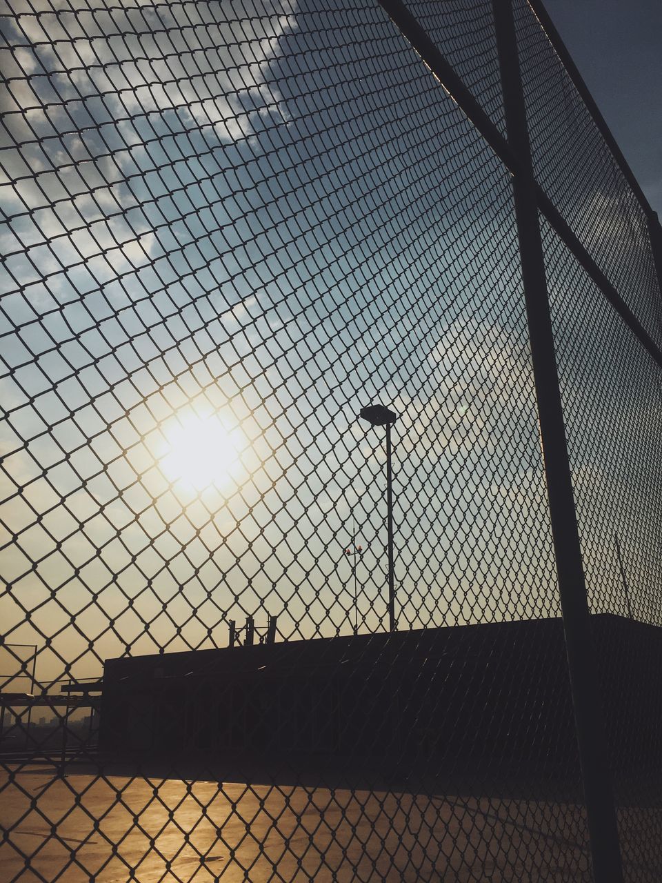 LOW ANGLE VIEW OF FENCE AGAINST SKY