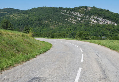 Road amidst green landscape