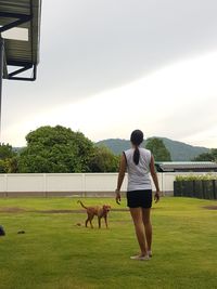 Full length of man with dog