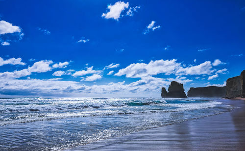 Scenic view of sea against blue sky