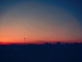 Silhouette landscape against scenic sky