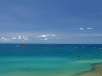 Scenic view of sea against blue sky