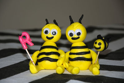 Close-up of yellow toys on table