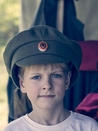 Close-up portrait of cute boy wearing hat