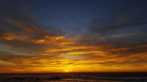 Scenic view of dramatic sky over sea