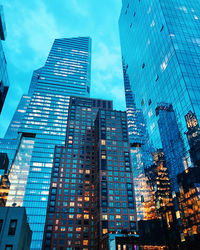 Low angle view of modern buildings against sky in city