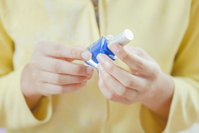Close-up of woman holding hands