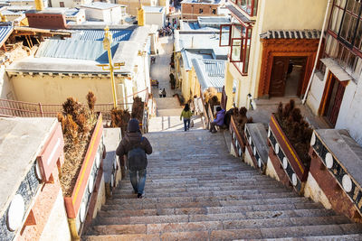 High angle view of woman moving down steps