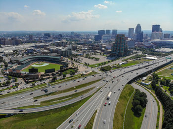High angle view of street amidst buildings against sky