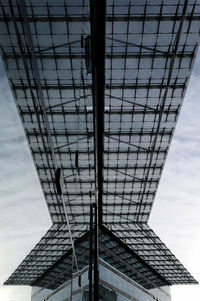Low angle view of communications tower against sky