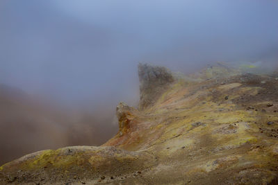 Scenic view of volcanic mountain against sky