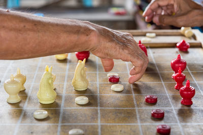 Close-up of hand playing board game