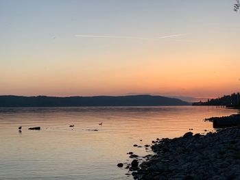 Scenic view of sea against sky during sunset