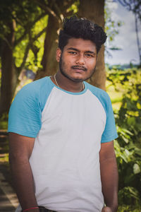 Portrait of young man standing outdoors