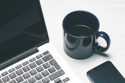 High angle view of coffee cup on table