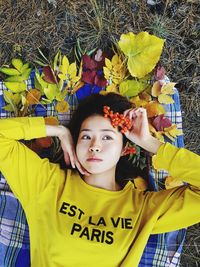 Portrait of happy girl with leaves