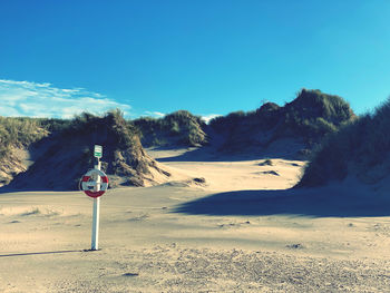 Scenic view of landscape against clear blue sky