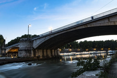 Bridge over river against sky