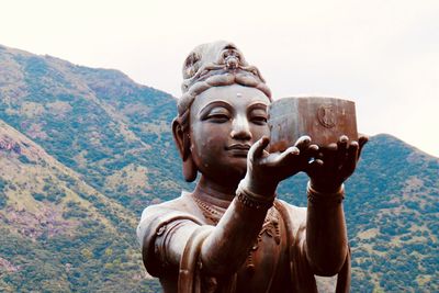 Statue of buddha against sky