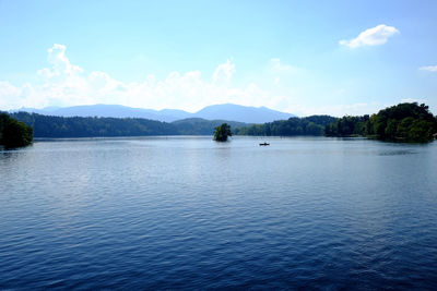 Scenic view of mountains against blue sky