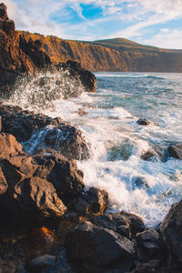 Sea waves splashing on rocks