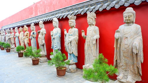 Statue outside temple against building